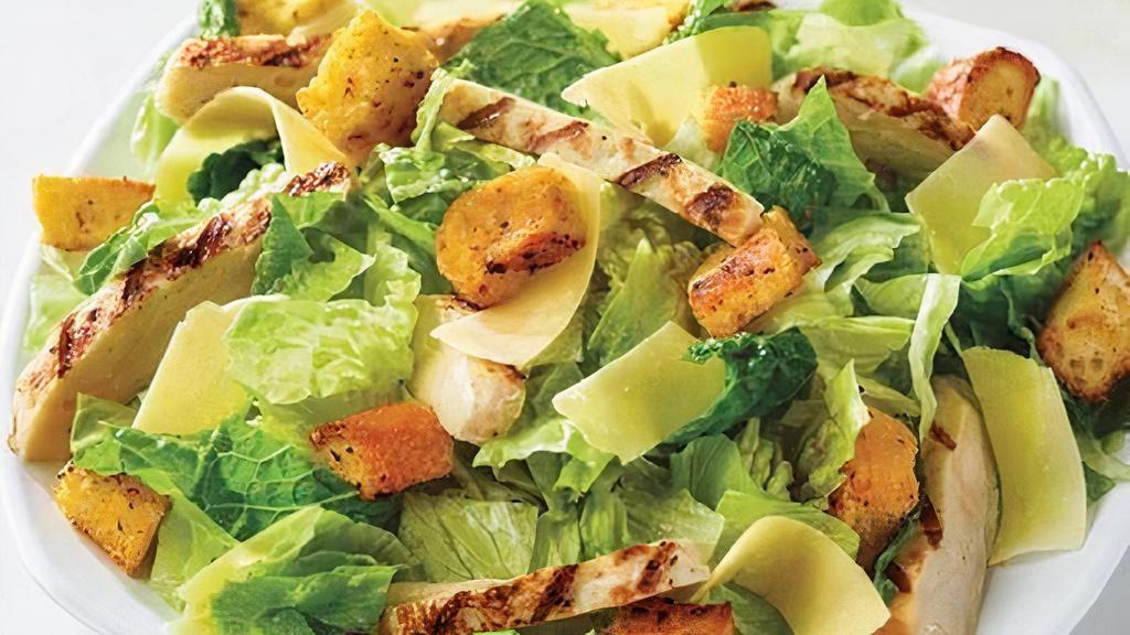 Chicken Caesar Salad (Family) · Fresh-cut lettuce blend, grilled chicken, Parmesan cheese, and croutons made daily; served with caesar dressing (230 added cal.). Family (4 servings): 530 cal./133 cal. per serving.