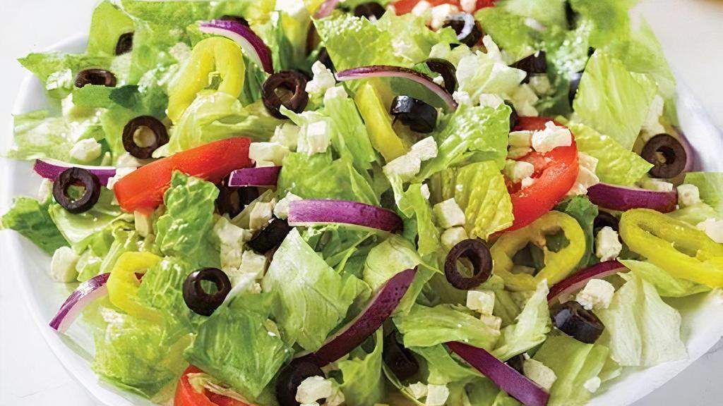 Greek (Family - 4 Servings) · Fresh-cut lettuce blend, feta cheese crumbles, black olives, sliced tomatoes, red onions, and banana peppers; served with Greek dressing (220 added cal.). 380 cal.; 95 cal. per serving.