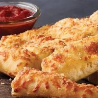 Cheezy Bread · Fresh-baked bread strips with our signature three cheeses and garlic sauce, served with a si...
