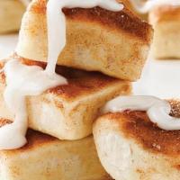 Cinna Squares (16 Pieces) · Fresh-baked, buttery pastry topped with cinnamon and sugar, served with a side of vanilla ic...