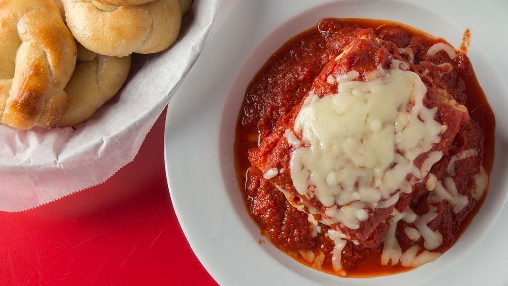 Lasagna · Large portion of our famous homemade lasagna made with all fresh ingredients and topped with homemade meat sauce and mozzarella cheese. Baked to perfection and served with a Graziano family homemade roll.