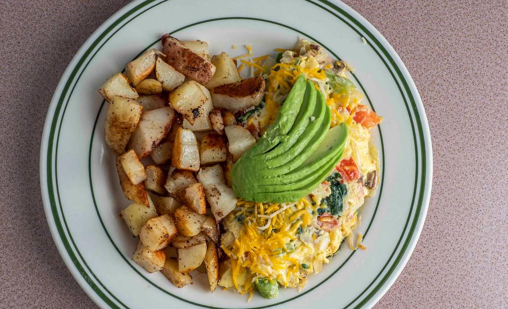Vegetarian Omelet · Onions, bell pepper, mushroom, tomato, spinach, avocado, jack, and cheddar cheese. Served with potatoes and toast.
