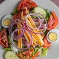 Chef Salad · Ham, turkey, swiss and American cheese, red onion, cucumber, tomato and egg on a bed of mixe...
