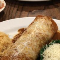 Wet Burrito · Chicken or beef burrito topped with enchilada sauce and melted cheese.