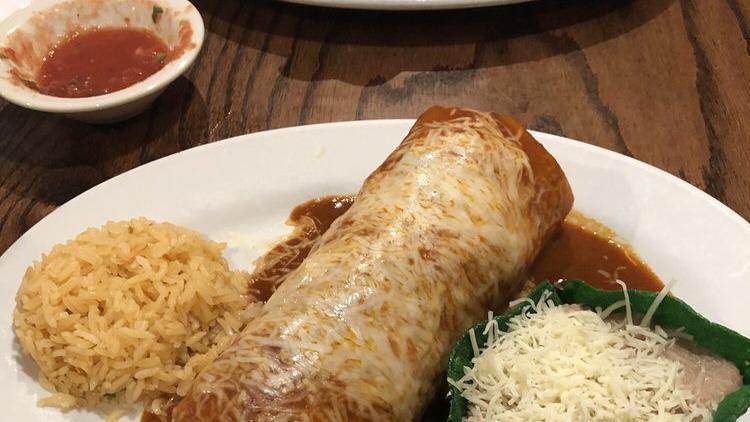 Wet Burrito · Chicken or beef burrito topped with enchilada sauce and melted cheese.