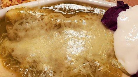 Enchilada (2) · Your choice of beef, chicken or cheese. Topped with sour cream.