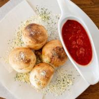Garlic Cheese Rolls (5) · Our daily fresh prepared dough formed in mid size knots filled with garlic and  mozzarella c...