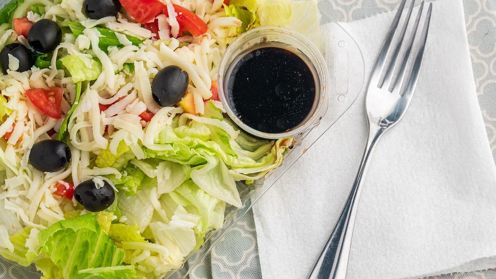 House Salad · Romaine lettuce, diced tomatoes, red onions, mozzarella cheese, and cucumbers.