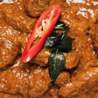 Lamb Madras Curry · Spicy lamb in a curry sauce.