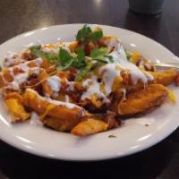 O.B Fries (South Of The Border) · Our season fries topped with chorizo, Jalapeno, cheddar and drizzled with sour cream.