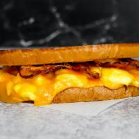 Sourdough, Bacon, Egg, & Cheddar Sandwich · 2 scrambled eggs, melted Cheddar cheese, smoked bacon, and Sriracha aioli on buttery toasted...
