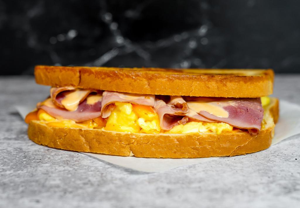 Sourdough, Ham, Egg, & Cheddar Sandwich via Neighborhood Cafe