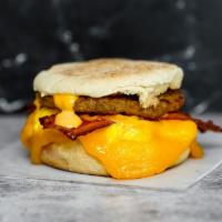 English Muffin, Bacon, Sausage, Egg, & Cheddar Sandwich · 2 scrambled eggs, melted Cheddar cheese, smoked bacon, breakfast sausage, and Sriracha aioli...