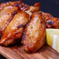 Lemon Pepper Chicken Wings · Chicken wings smothered in lemon and pepper for delicious taste.