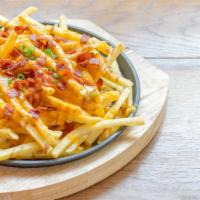 Bacon & Cheese Fries · Our golden fries smothered with crispy bacon pieces and melted cheese.