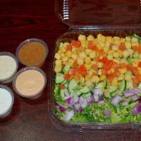 Side Salad · Leafy greens, tomato, cucumber, purple onion, and garlic croutons.