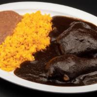 Mole Negro · Choice of : Pollo | Puerco. Oaxacan black mole prepared with dried Oaxacan chiles, nuts, see...