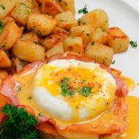 Traditional Benedict · Two Poached Eggs Served on an English Muffin with Canadian Bacon & Topped with Hollandaise S...