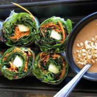 Summer Rolls · Cut to 6. Mix green, cucumbers, carrots, basil and cilantro wrapped in rice paper, Served wi...