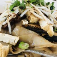 Sweet Soy Noodle · Tofu, shiitake mushroom, onion, bean sprouts, crispy garlic, preserved cabbage, and cilantro.