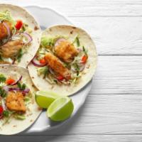 Fish Taco · Fresh fried battered fish in a flour tortilla topped with fresh shredded cabbage, house pico...
