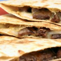 Beef Quesadilla · Melted cheese and marinated beef folded into a warm flour tortilla.