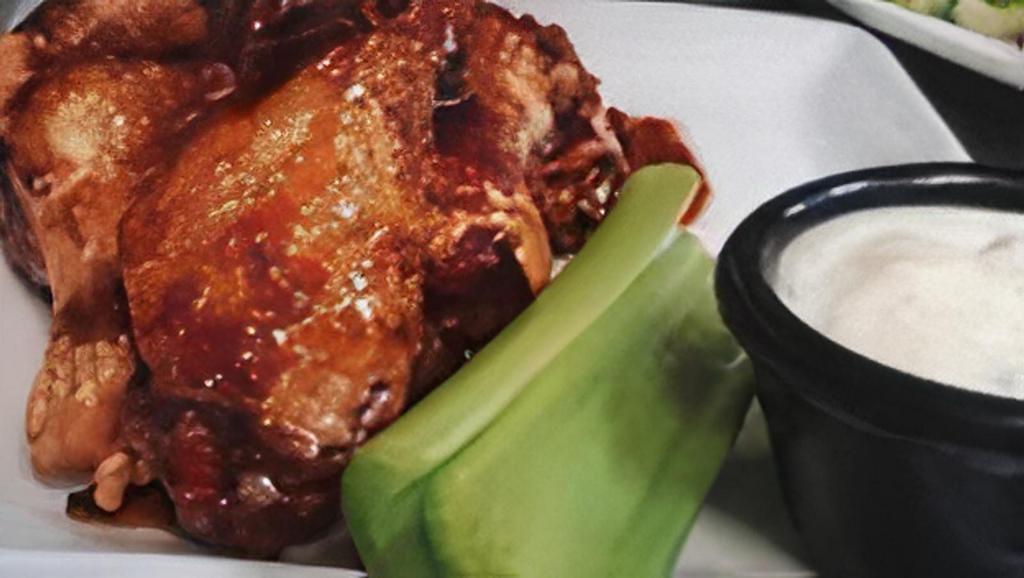 Chicken Wings · 7 of our delicious jumbo wings fried and tossed in your choice of buffalo sauce, house made teriyaki sauce, or our in- house guiness BBQ served with celery sticks
