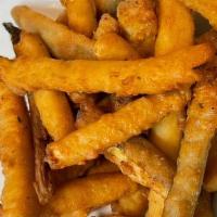 Pickle Fries · Crispy/Tangy thinly cut pickle spears lightly coated in a premium cornmeal and spicy mustard...