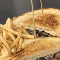 Patty Melt · 8oz CAB patty topped with both melted swiss and cheddar cheese, sauteed mushrooms, carameliz...