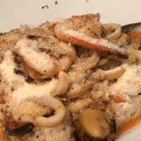 Risotto Alla Pescatora · Mussels, clams, shrimp, scallops, calamari and a hint of marinara sauce.
