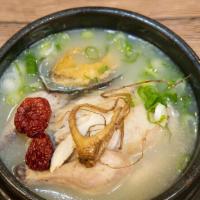 Wild Ginseng Abalone Chicken Soup (산삼전복삼계탕) · Wild ginseng chicken soup with abalone and chicken stuffed with sticky rice, jujubes and gar...