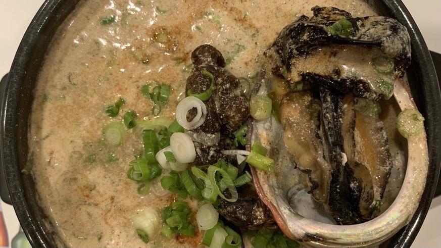 Red Ginseng Abalone Chicken Soup (홍삼전복삼계탕) · Red Ginseng chicken soup with abalone and chicken stuffed with stick rice, jujubes, and garlic.