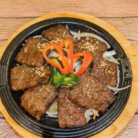 Tteok Galbi (떡갈비) · Ground beef rib meat patties marinated in soy sauce seasoning and then grilled.