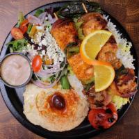 Chicken Kebob Plate · Two (2) halal chicken tender kebabs served with 3 sides of your choice, grilled tomato, jala...