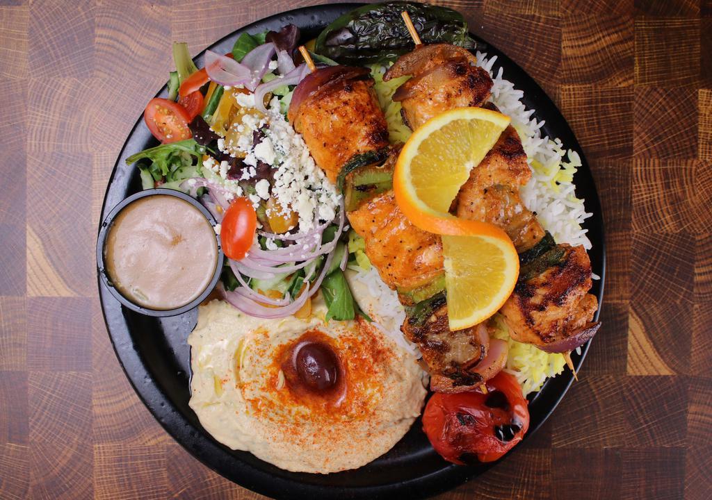 Chicken Kebob Plate · Two (2) halal chicken tender kebabs served with 3 sides of your choice, grilled tomato, jalapeño, and pita bread.
