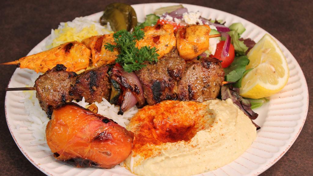 Combo Kebob Plate · One (1) beef kebob and one (1) chicken kebob served with 3 sides of your choice, grilled tomato & jalapeño and pita bread.