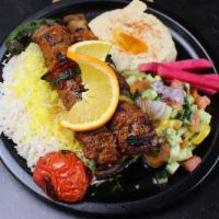 Beef Kebob Plate · Two (2) halal beef flap meat kebabs served with 3 sides of your choice, grilled tomato & jal...