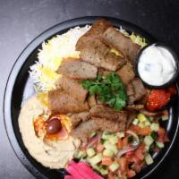 Gyro Meat  Plate · Halal lamb and beef gyro with tzatziki sauce, red onion and tomatoes. 
Served with fries or ...