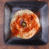 Hummus · Garbanzo Beans  with Tahini served and pita bread