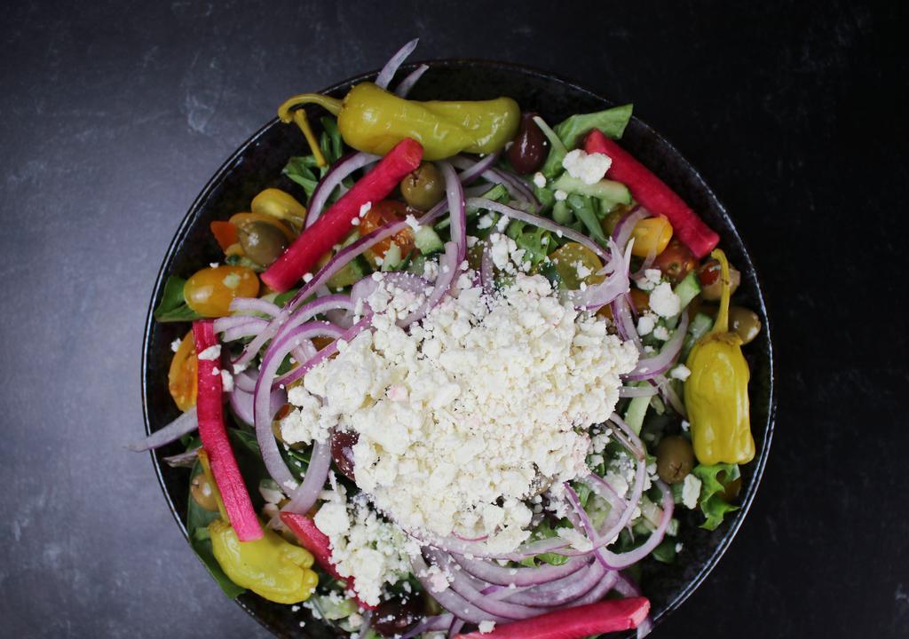 Greek Salad · Spring mix. Cherry tomatoes. cucumber. Kalamatta .green olives.  Red onions. S feta cheese.  pepperchinnis.  Balsamic  dressings.
