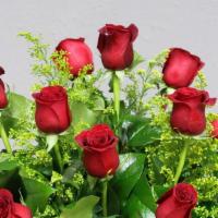 1 Dozen Red Roses · One dozen premium long stem red roses in a vase with greenery and filler.