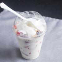 Strawberry Parfait · Strawberries, sweet milk cream, granola, shredded coconut, and raisins.