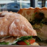 Pesto Chicken (Chicken) · Greens, basil pesto, pepper spread and di stefano mozzarella on toasted ciabatta.