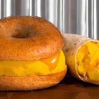 Egg & Cheese · Egg and cheese breakfast sandwich or burrito with cheddar cheese, served on your choice of b...