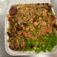 House Special Fried Rice · Wok tossed rice with eggs, onions, peas and carrots with choice of meats, topped with green ...