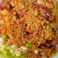Pork Fried Rice · Stir Fried rice with onions, egg, peas and carrots with pork and topped with green onions.