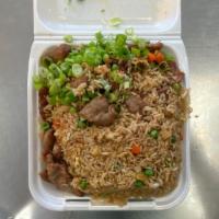 Beef Fried Rice · Stir Fried rice with onions, eggs, peas and carrots with beef and topped with green onions.