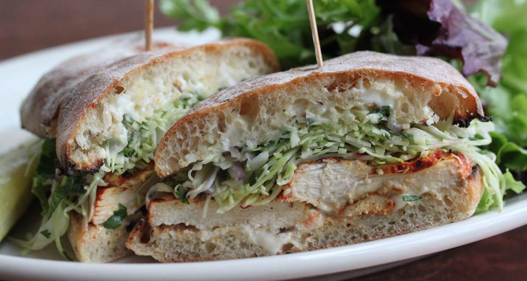 Achiote-Marinated Chicken · Cabbage and radish slaw, roasted green chile mayonnaise; on ciabatta.