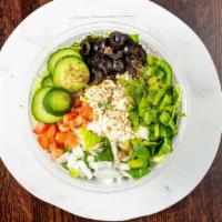 Greek Salad · Lettuce, cucumber, tomato, Feta, olives, red onion, green pepper, Zaatar, and lemon oil.