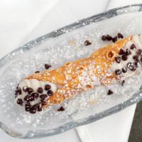 Cannoli · Delicate pastry shell filled with ricotta cream and chocolate chips. A Sicilian tradition!